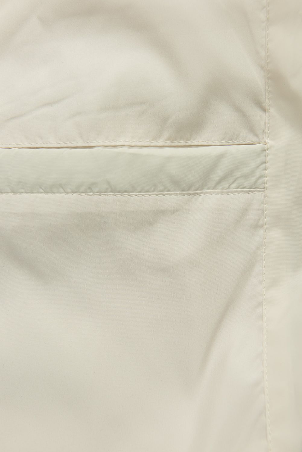 Ecru prechodná bunda s pletenými rukávmi