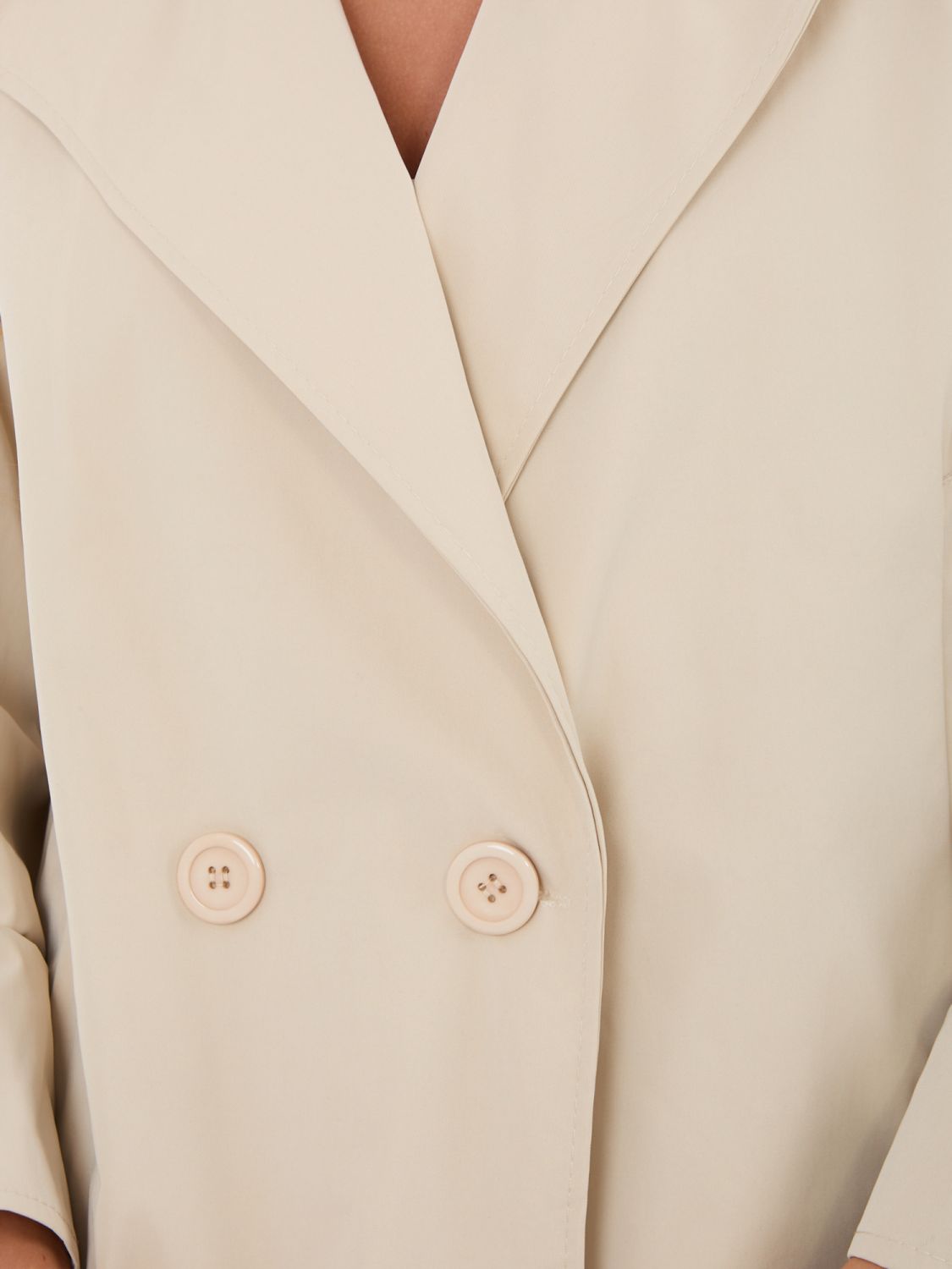 Krátky béžový prechodný kabát s podšívkou