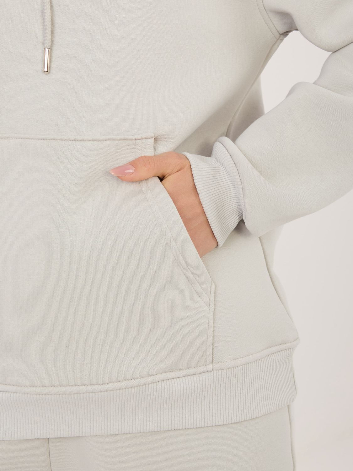 Dámska súprava s kapucňou v svetlosivej farbe